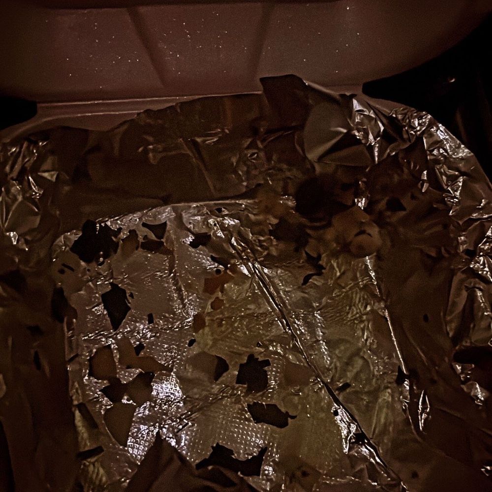 El Patio Catracho - a piece of tin foil on the ground - Food Trucks Near Me - Jacksonville, Florida