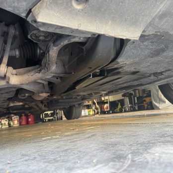 N Carolina Auto Solutions - Notice all of the missing screws and oil everywhere. This was after the so-called oil change. - Auto Repair Near Me - Smithfield, North Carolina