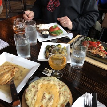 Craft 120 - a man eating a meal at a restaurant - Pubs Near Me - Newark, New York