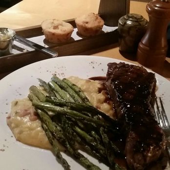 Roost - NY strip steak cheesy mashed taters and grilled asparagus with some corn bread muffins  treat yourself to this meal when you feel worth it - New American Near Me - Greenville, South Carolina