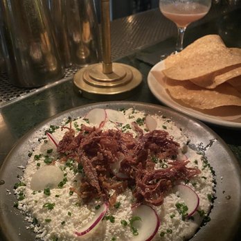 DAMA - Whipped beans $18 A MUST GET. Cotija cheese on top with crispy pork. Homemade tortilla chips. - Latin American Near Me - Los Angeles, California DAMA - Whipped beans $18 A MUST GET. Cotija cheese on top with crispy pork. Homemade tortilla chips. - Latin American Near Me - Los Angeles, California