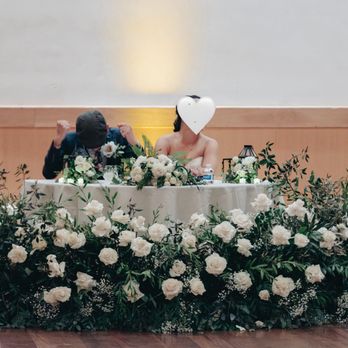 Hella Aloha - Ceremony arrangement that was then repurposed & reconfigured to become the arrangement for our sweetheart table in the reception. - Floral Designers Near Me
