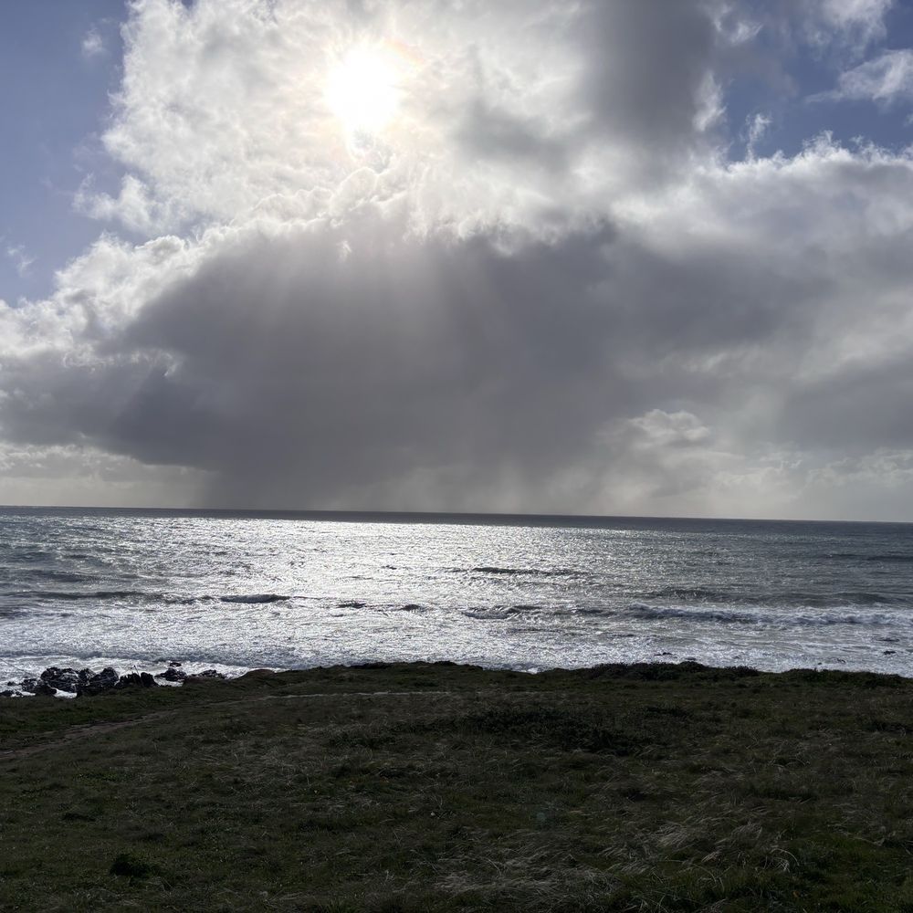 Harmony Headlands State Park - View from bench looking at ocean. In this photo, you can see a storm cloud dumping rain ahead. - Parks Near Me - Cayucos, California Harmony Headlands State Park - View from bench looking at ocean. In this photo, you can see a storm cloud dumping rain ahead. - Parks Near Me - Cayucos, California