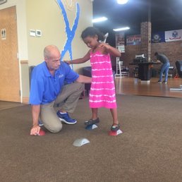 Mr. Hayden working with my daughter on strengthening her knee.