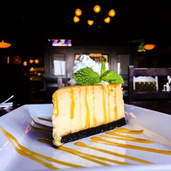 Fionn MacCool's - White Chocolate Cheesecake drizzled with butterscotch