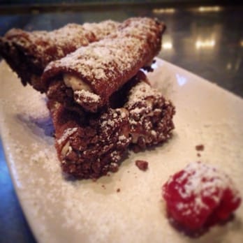 Red Table - Chocolate Cannoli with Ricotta filling dusted with powdered sugar - Gastropubs Near Me - Huntington Beach, California