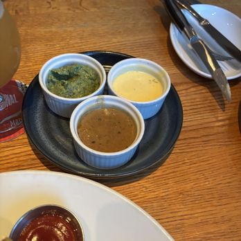 Chop Steakhouse & Bar - Trio of chimichurri, Bernaise, and peppercorn sauces. - Steakhouses Near Me - Etobicoke, Ontario Chop Steakhouse & Bar - Trio of chimichurri, Bernaise, and peppercorn sauces. - Steakhouses Near Me - Etobicoke, Ontario