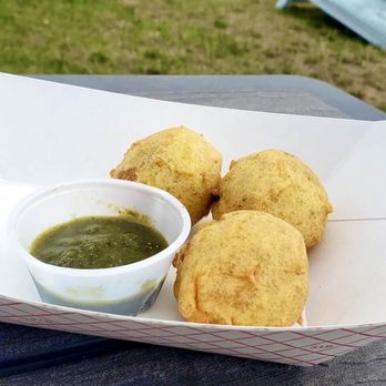 Masala Magic by Anita - Batata Vada with cilantro chutney dip - Indian Near Me - Elk Rapids, Michigan Masala Magic by Anita - Batata Vada with cilantro chutney dip - Indian Near Me - Elk Rapids, Michigan