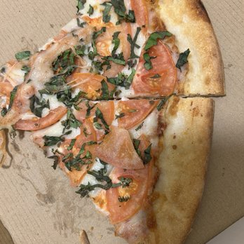 1400 Bar & Grill - Cheese pizza with sliced tomatoes trying to be a Margherita, the other slices were butchered and doctored by kids - American Near Me - Alameda, California