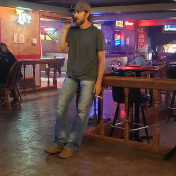 Cactus Bar - a man singing into a microphone - Bars Near Me - Amarillo, Texas