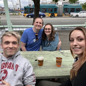 Paseo - Friends enjoying the outdoor seating. - Caribbean Near Me - Seattle, Washington