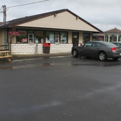 Exterior of store showing some of ample parking.
