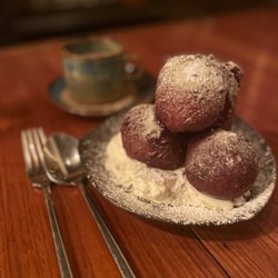 Ilda - Sylva - Hot apple fritters dusted with confectionate sugar on a pillow of lavender whipped cream. A great finish to an excellent dinner!
