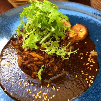 Los Danzantes - Chicken with mole coloradito sprinkled with amaranth seeds and garnished with slices of plantain. - Mexican Near Me - Oaxaca, OAX Los Danzantes - Chicken with mole coloradito sprinkled with amaranth seeds and garnished with slices of plantain. - Mexican Near Me - Oaxaca, OAX