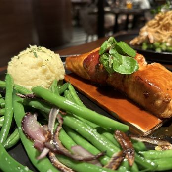 Julep Cast Iron Kitchen + Drink - Bacon wrapped cedar plank salmon - New American Near Me - Brea, California Julep Cast Iron Kitchen + Drink - Bacon wrapped cedar plank salmon - New American Near Me - Brea, California