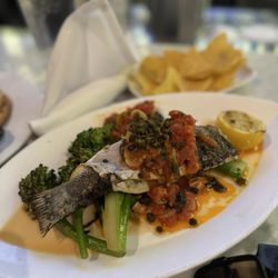 Hank’s Oyster Bar on the Wharf - Grilled Branzino with lemon caper sauce over broccolini