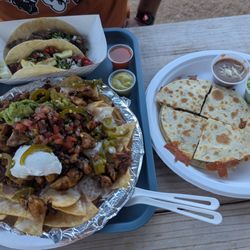 Mission X Tacos - Borracho nachos, quesadilla (w/beans, avocado, sour cream, chipotle crema), bistec taco/flour, pastor taco/corn, red and green salsas.