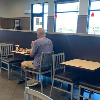 Chick-fil-A - Hubby sitting at the table. - Fast Food Near Me - Laguna Hills, California Chick-fil-A - Hubby sitting at the table. - Fast Food Near Me - Laguna Hills, California