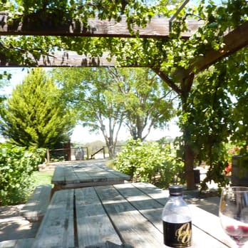 The Wine Line - Castoro Cellars picnic bench area under the trellis overlooking the vines - Wine Tours Near Me The Wine Line - Castoro Cellars picnic bench area under the trellis overlooking the vines - Wine Tours Near Me