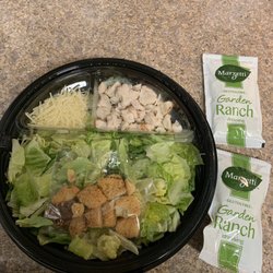 Chicken Caesar salad... note the little divided tray holding the chicken and cheese, and bag of croutons. Just mix together!