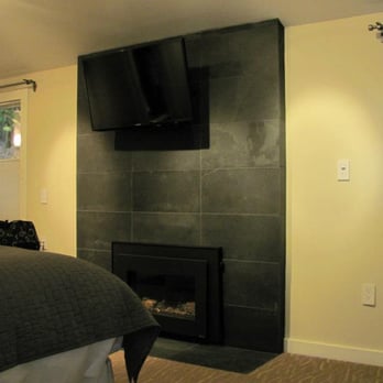 Olea Hotel - Fireplace with mounted TV in upper right-hand corner room. (King room with Fireplace) - Hotels Near Me - Glen Ellen, California Olea Hotel - Fireplace with mounted TV in upper right-hand corner room. (King room with Fireplace) - Hotels Near Me - Glen Ellen, California
