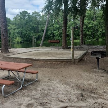 Savannah South KOA - Camp ground with picnic table, sand bed, bench, grill, firepit and a water tap that you can't see in this picture. - Campgrounds Near Me - Richmond Hill, Georgia Savannah South KOA - Camp ground with picnic table, sand bed, bench, grill, firepit and a water tap that you can't see in this picture. - Campgrounds Near Me - Richmond Hill, Georgia