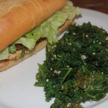Imagine Vegan Cafe - Jerk Chicken sandwich on hoagie roll with side of garlic kale. - Vegan Near Me - Memphis, Tennessee Imagine Vegan Cafe - Jerk Chicken sandwich on hoagie roll with side of garlic kale. - Vegan Near Me - Memphis, Tennessee