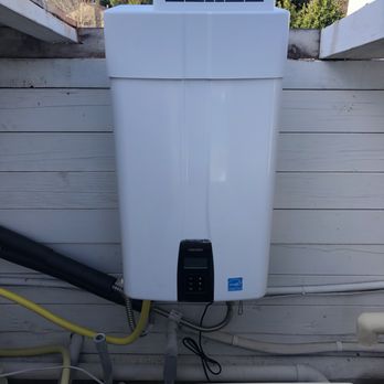 Freedom Plumbing - Out door tankless - Plumbing Near Me