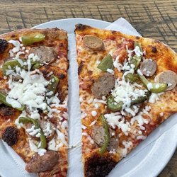 The Italian Corner - Two slice special with sausage and peppers.