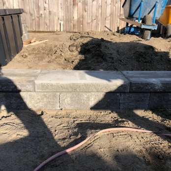 Gracey Landscape & Hydroseeding - a concrete retaining wall being built - Landscaping Near Me - Kingston, Washington Gracey Landscape & Hydroseeding - a concrete retaining wall being built - Landscaping Near Me - Kingston, Washington