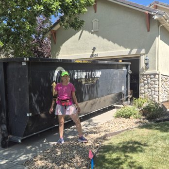 Humpty Dump Roll-Offs & Dumpsters - Lucy owner of ClearPath Estate Sales in front of large dumpster after dumping lots of stuff. - Dumpster Rental Near Me - Commerce City, Colorado Humpty Dump Roll-Offs & Dumpsters - Lucy owner of ClearPath Estate Sales in front of large dumpster after dumping lots of stuff. - Dumpster Rental Near Me - Commerce City, Colorado