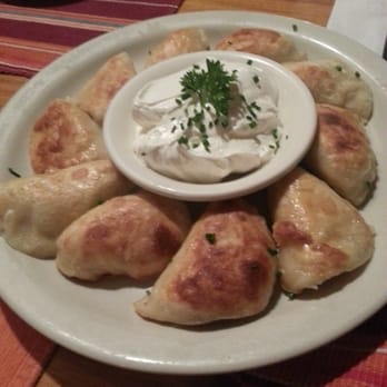 Koliba - Fried potato pierogies with sour cream - Modern European Near Me - Astoria, New York Koliba - Fried potato pierogies with sour cream - Modern European Near Me - Astoria, New York