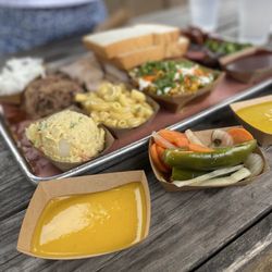 The Pit Room - Museum District - A variety of meats, sides, and sauces