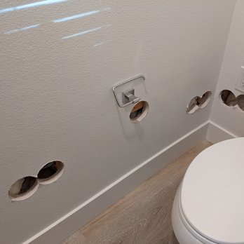 Dream Home Design & Build - Holes made in the toilet in the master bath - General Contractors Near Me Dream Home Design & Build - Holes made in the toilet in the master bath - General Contractors Near Me