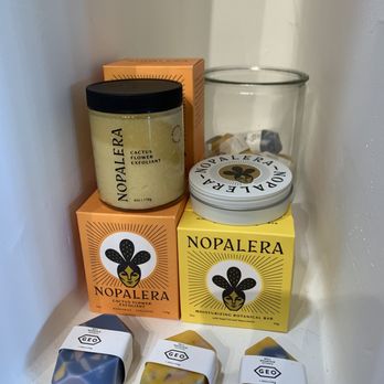Luna and Luz - Nopalera - Collection of Nopalera skincare products, including cactus flower exfoliant, moisturizing botanical bar, and soap bars, arranged on a shelf. - Jewelry Near Me - Albuquerque, New Mexico