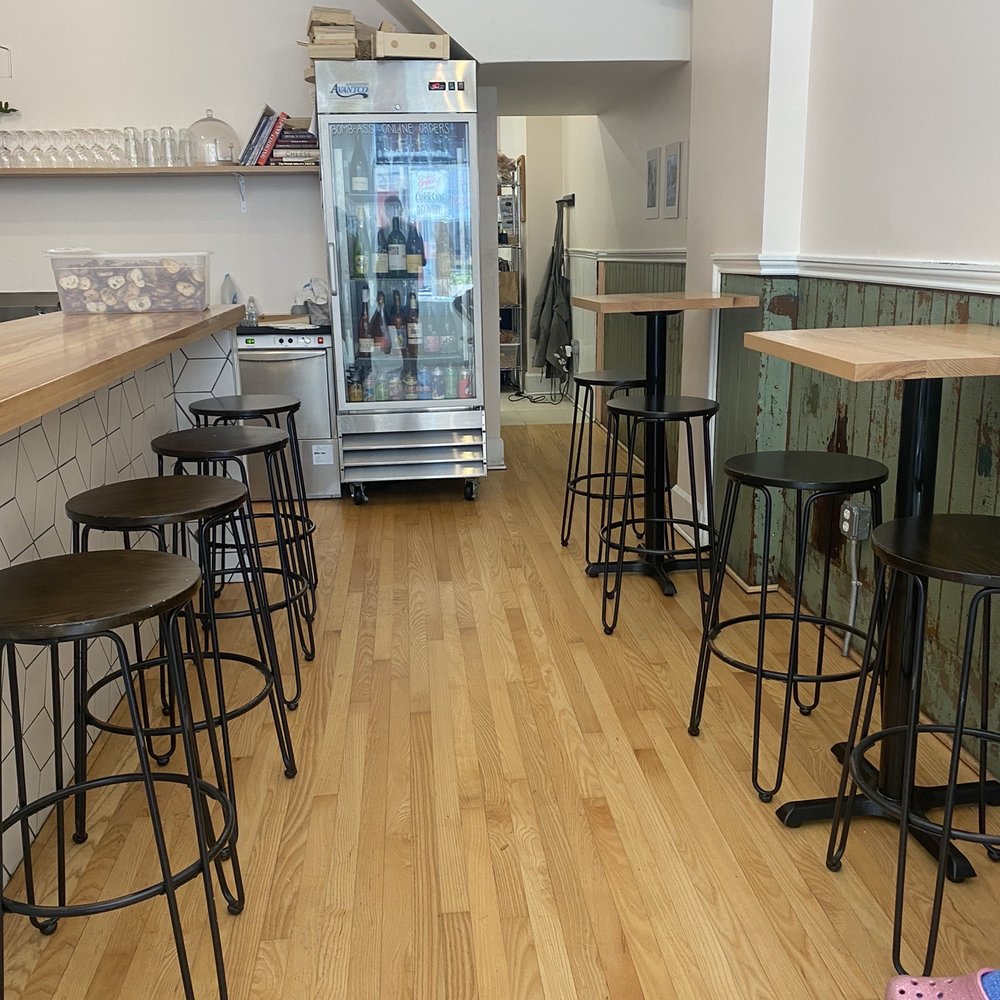 The Rhined - a kitchen with a refrigerator and bar stools - Cheese Shops Near Me - Cincinnati, Ohio The Rhined - a kitchen with a refrigerator and bar stools - Cheese Shops Near Me - Cincinnati, Ohio