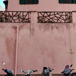 Comune di Procida - Typical residential sights mopeds Vespas and colorful residences