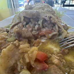 Inside the pork salsa verde burrito; super tender pork and the best beans I've had in WA. Inside the pork salsa verde burrito; super tender pork and the best beans I've had in WA.