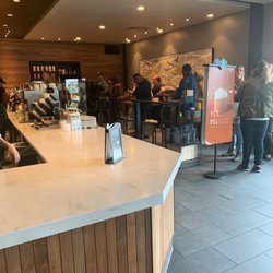 Starbucks - 4 staff 1 on the register everybody waiting to order
