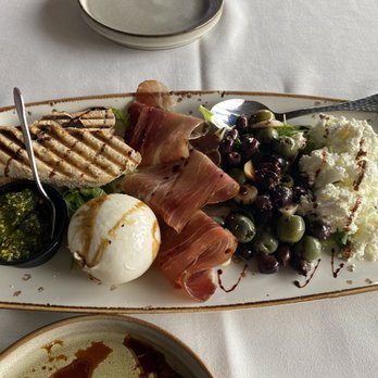 Cafe Gabbiano - Charcuterie with prosciutto, olives, goat cheese, burrata, pesto, and crostini. - Italian Near Me - Sarasota, Florida Cafe Gabbiano - Charcuterie with prosciutto, olives, goat cheese, burrata, pesto, and crostini. - Italian Near Me - Sarasota, Florida