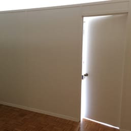 Temporary (bookcase) wall with door. Perfectly done and looks like a real wall