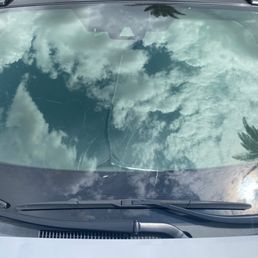 Broken windshield by a flying golf ball Broken windshield by a flying golf ball