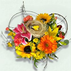 Birds nest bouquet only at Flowers and Such. Seasonal fresh blooms surround a birds nest