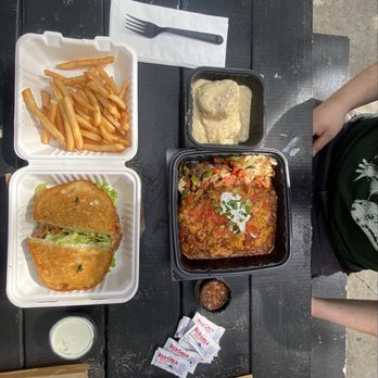 Jongewaard's Bake n Broil - cajun chicken sandwich with fries  & the chili and cheese omelette with seasoned potatoes and a side of biscuits and gravy - American Near Me - Long Beach, California