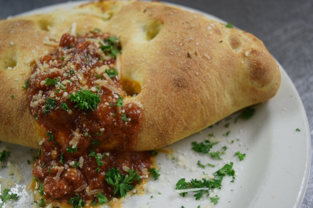 Order Cheese Calzone food online from Reginelli's Pizzeria store, New Orleans on bringmethat.com