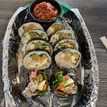 K-BOP - a tray of sushi rolls with sauce - Korean Near Me - San Marcos, Texas