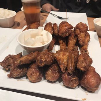 Bonchon Costa Mesa - Half soy garlic and half spicy large combo! - Chicken Wings Near Me - Costa Mesa, California