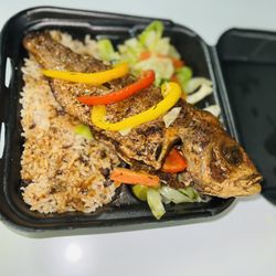 Irie Jamaican Cuisine - Escovitch Fish on a bed of Cabbages served along with Rice and Peas