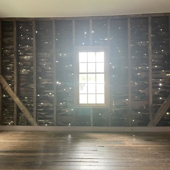 The Carter House - Wall showing damage from the battle in an outbuilding. - Museums Near Me - Franklin, Tennessee