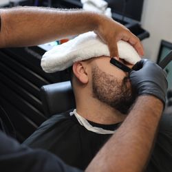 The Hidden Barbershop - Hot towel shave! Infused with essential oils. Standard with every beard service. Shave by Danny